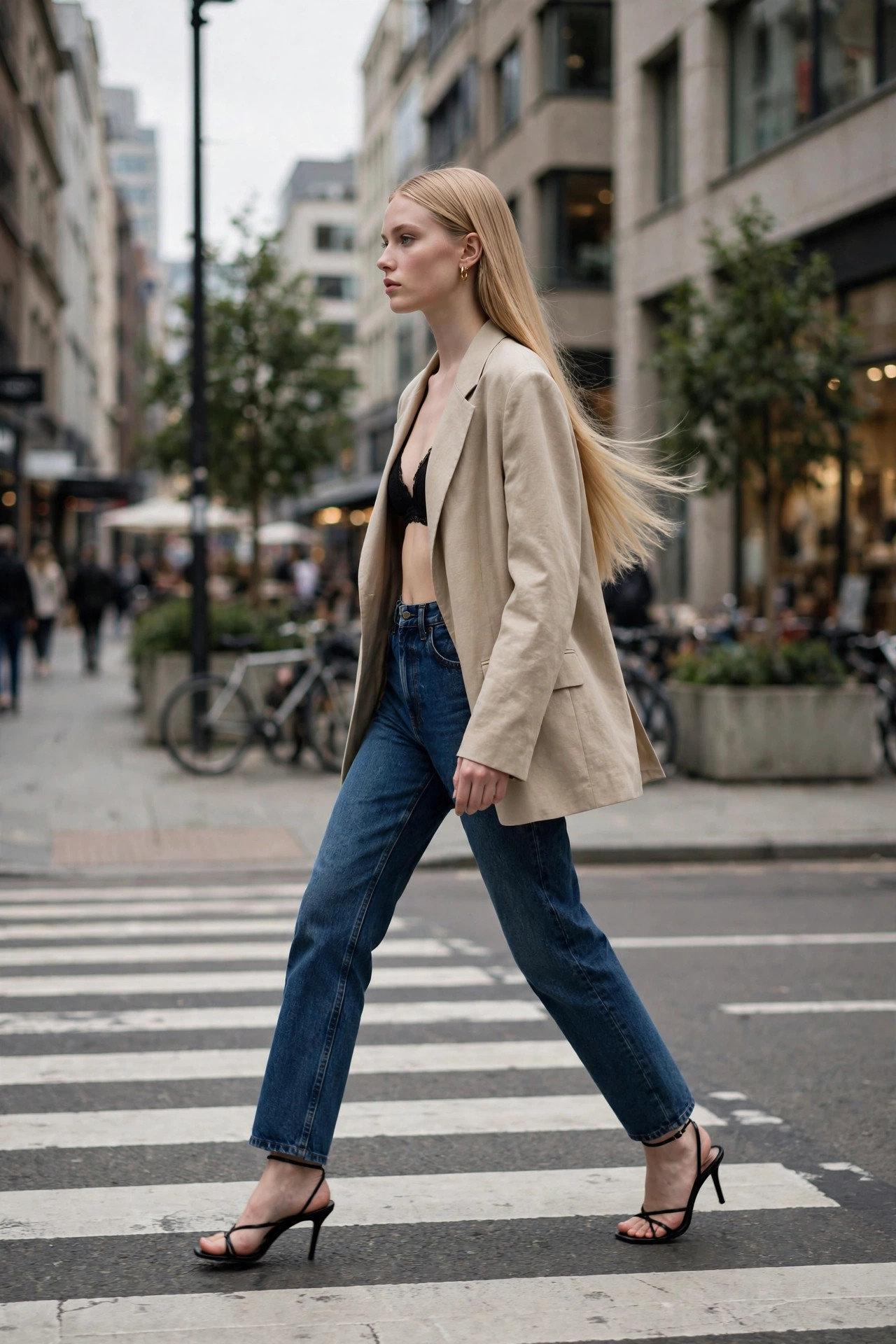 Rosé-inspired oversized beige blazer over black bralette top and high-waisted straight jeans with strappy heels
